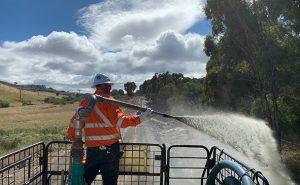 spraying hydromulch from truck